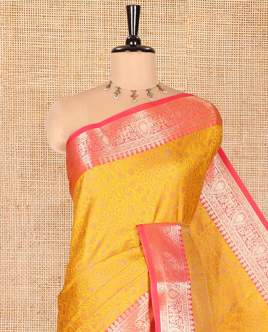Mustard Elite Soft Silk Saree, Subtly Sparkled with Floral-Paisley Designs On Its Body, Complemented by Contrast Traditional Zari Designs Woven Border, Intricately Designed Pallu, and Paired with a Matching Blouse