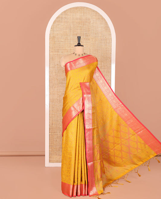 Mustard Elite Soft Silk Saree, Subtly Sparkled with Floral-Paisley Designs On Its Body, Complemented by Contrast Traditional Zari Designs Woven Border, Intricately Designed Pallu, and Paired with a Matching Blouse