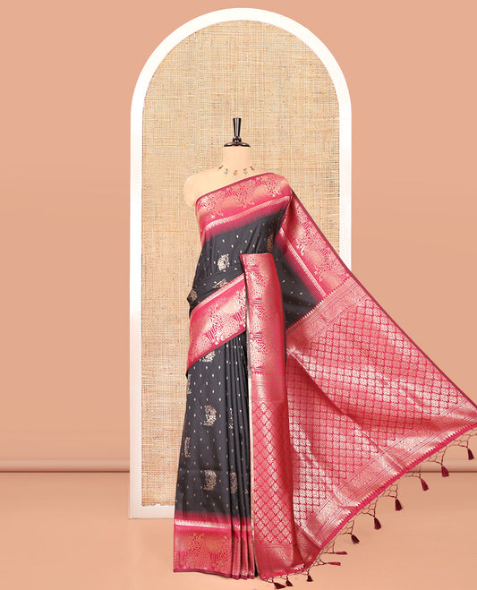 Black Elite Soft Silk Saree, Woven with Zari Buttas on Its Body, Complemented by a Contrast Peacock-Floral Zari Blouse, Intricately Designed Pallu, and Paired with a Contrast Blouse