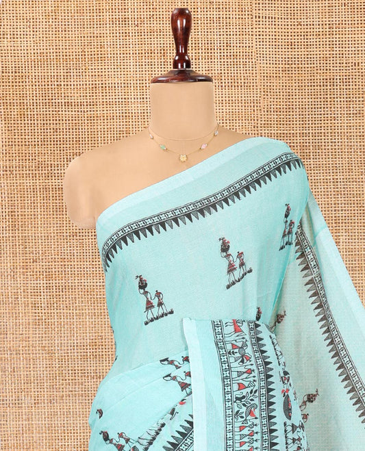 Light Rama Khadi Mul Cotton Saree, Artfully Printed with Warli Motifs All Over Its Body, Highlighted by a Self-Border of Warli Print, Pallu of Warli Print, and Paired with a Matching Blouse