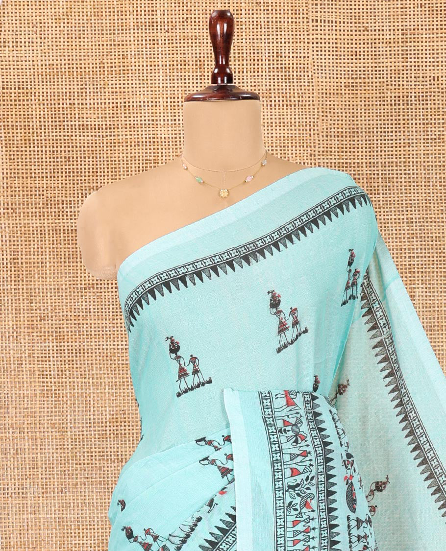 Light Rama Khadi Mul Cotton Saree, Artfully Printed with Warli Motifs All Over Its Body, Highlighted by a Self-Border of Warli Print, Pallu of Warli Print, and Paired with a Matching Blouse