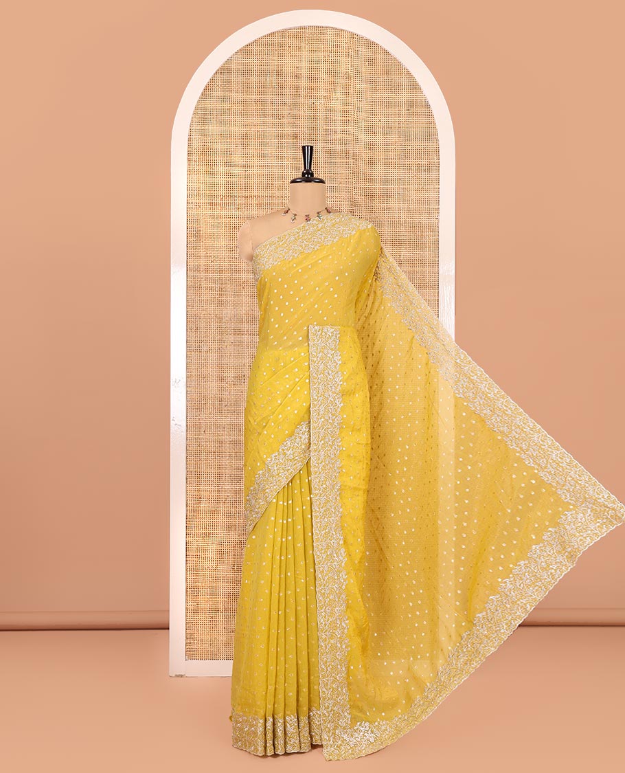 Yellow Fendi Chiffon Saree, Steeped with 1000-Buttas All Over Its Body, Highlighted by a Scallop Embroidered Border, a Self-Pallu, and Paired with a Matching Blouse