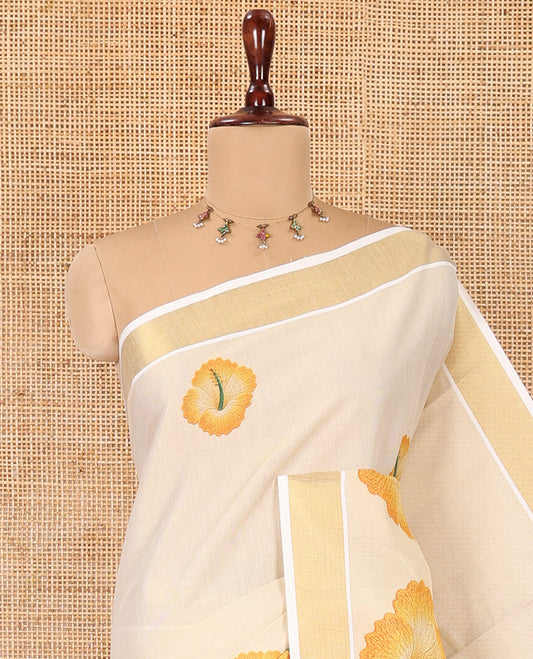 Cream Kerala Cotton Saree, Beautified with Hibiscus Motifs, a Zari Border, Hibiscus Pallu, and a Contrast Blouse