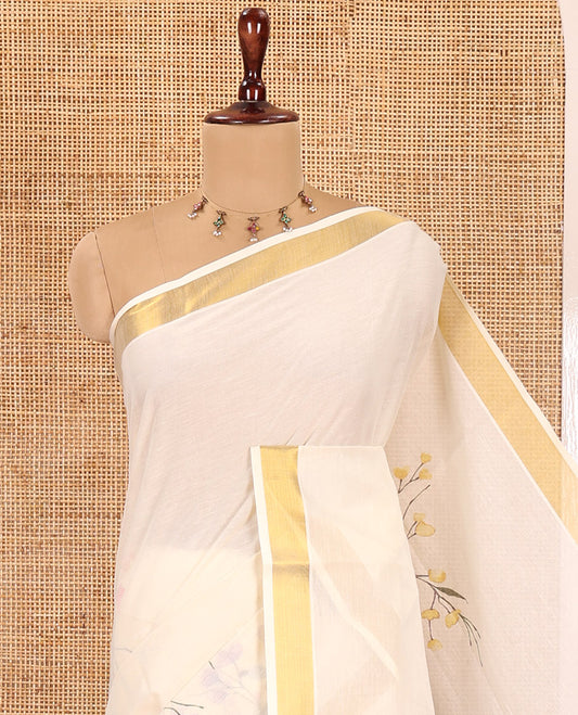 Cream Kerala Cotton Saree, Beautified with Floral Print, a Zari Border, Floral Pallu, a Contrast Blouse