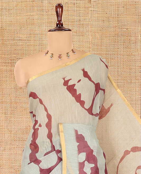 Pista Green Linen Cotton Saree, Adorned with Shibori Print, Gold Piping Border, Contrast Floral Printed Pallu, and Contrast Floral Printed Blouse