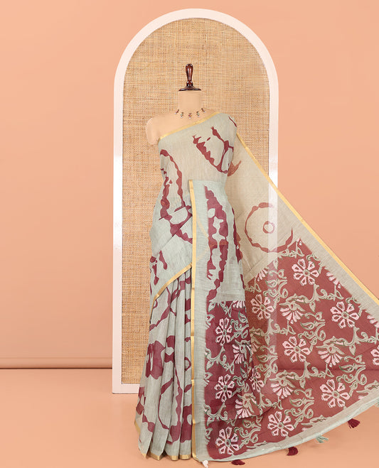 Pista Green Linen Cotton Saree, Adorned with Shibori Print, Gold Piping Border, Contrast Floral Printed Pallu, and Contrast Floral Printed Blouse