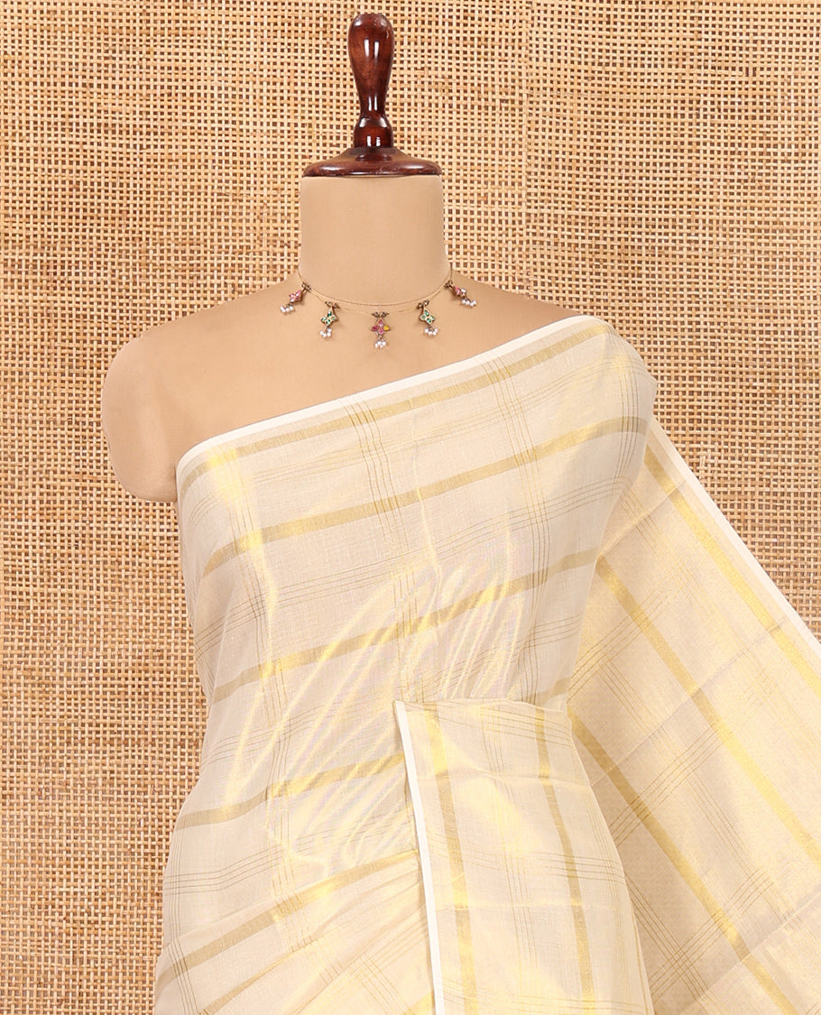 Borderless Gold Kerala Tissue Saree, Gleamed Up with Zari Checked Design, a Self-Pallu, and a Matching Blouse