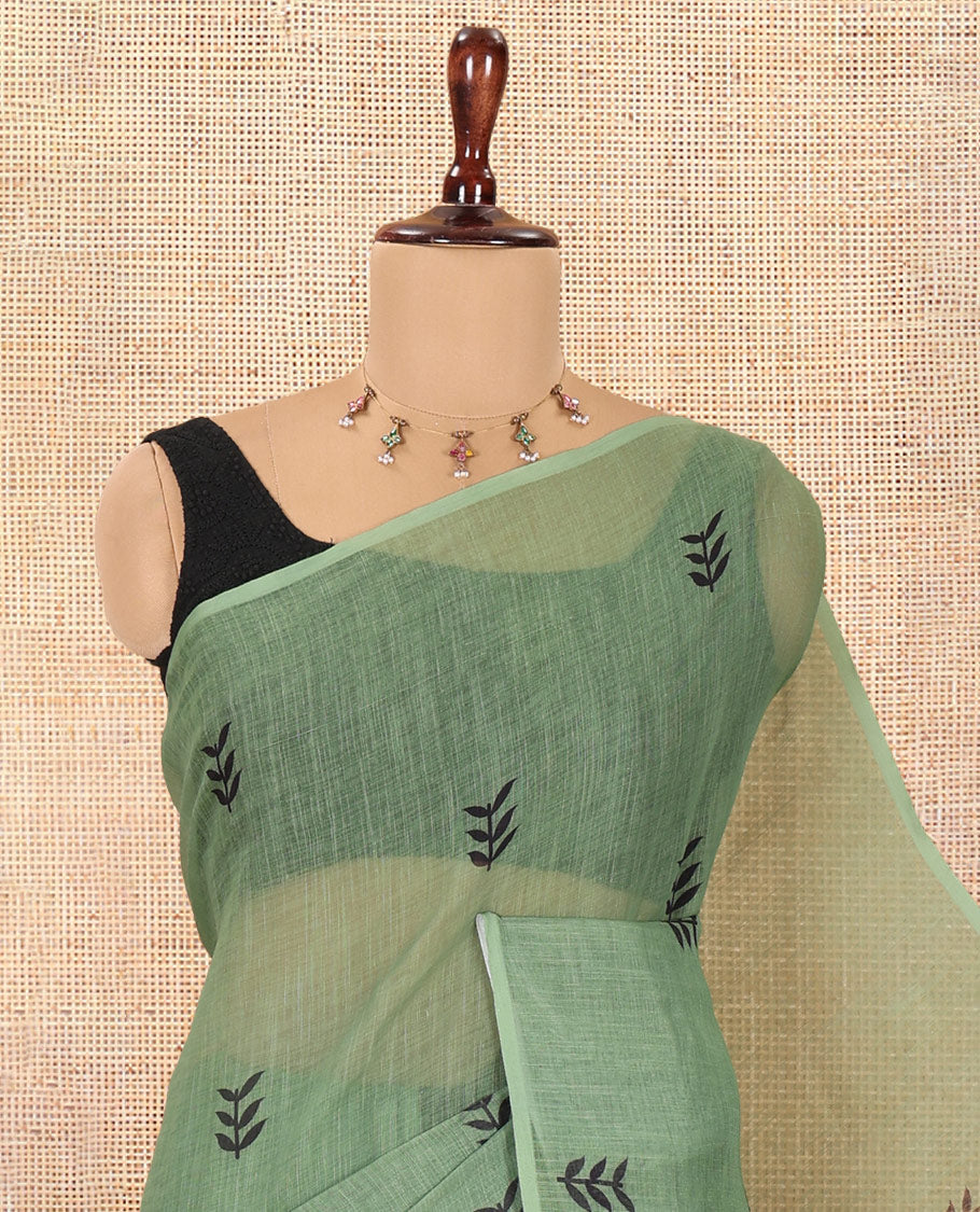 Borderless Olive Green Linen Cotton Saree, Adorned with Leaf Print, a Contrast Leaf-Printed Pallu, and Contrast Blouse
