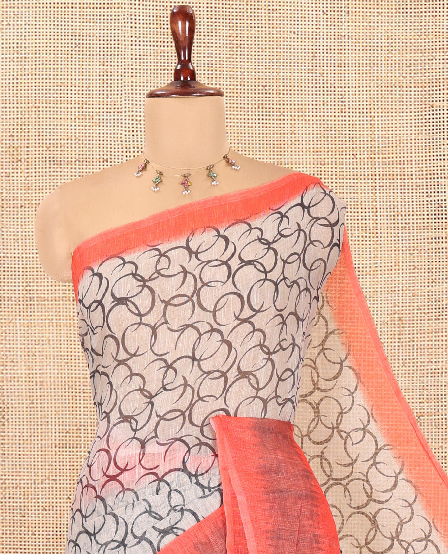 Chikku-Orange Linen Cotton Saree, Elevated with Geometric Print, a Contrast Ikat Border, Printed Pallu, and Contrast Blouse