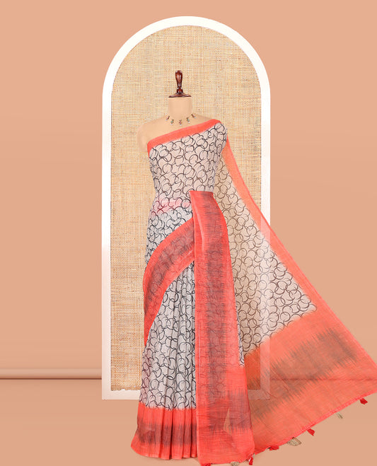 Chikku-Orange Linen Cotton Saree, Elevated with Geometric Print, a Contrast Ikat Border, Printed Pallu, and Contrast Blouse