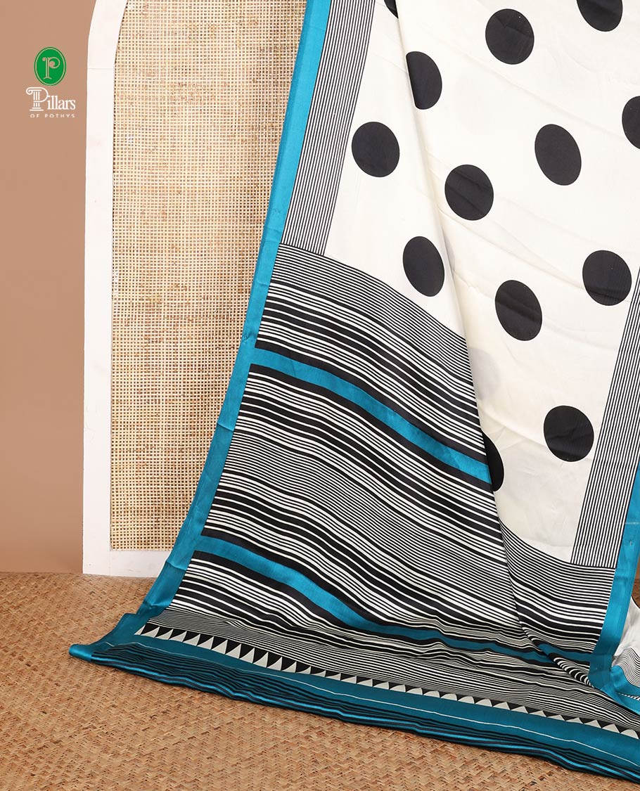 Cream with blue polka dot printed design gajji silk saree with contrast piping border & printed pallu along with striped blouse