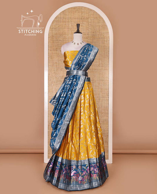 Haldi yellow taffeta silk half saree, floral jaal jacquard skirt, contrast wine zari meenakari style bird border, matching blouse, and floral jaal dhavani