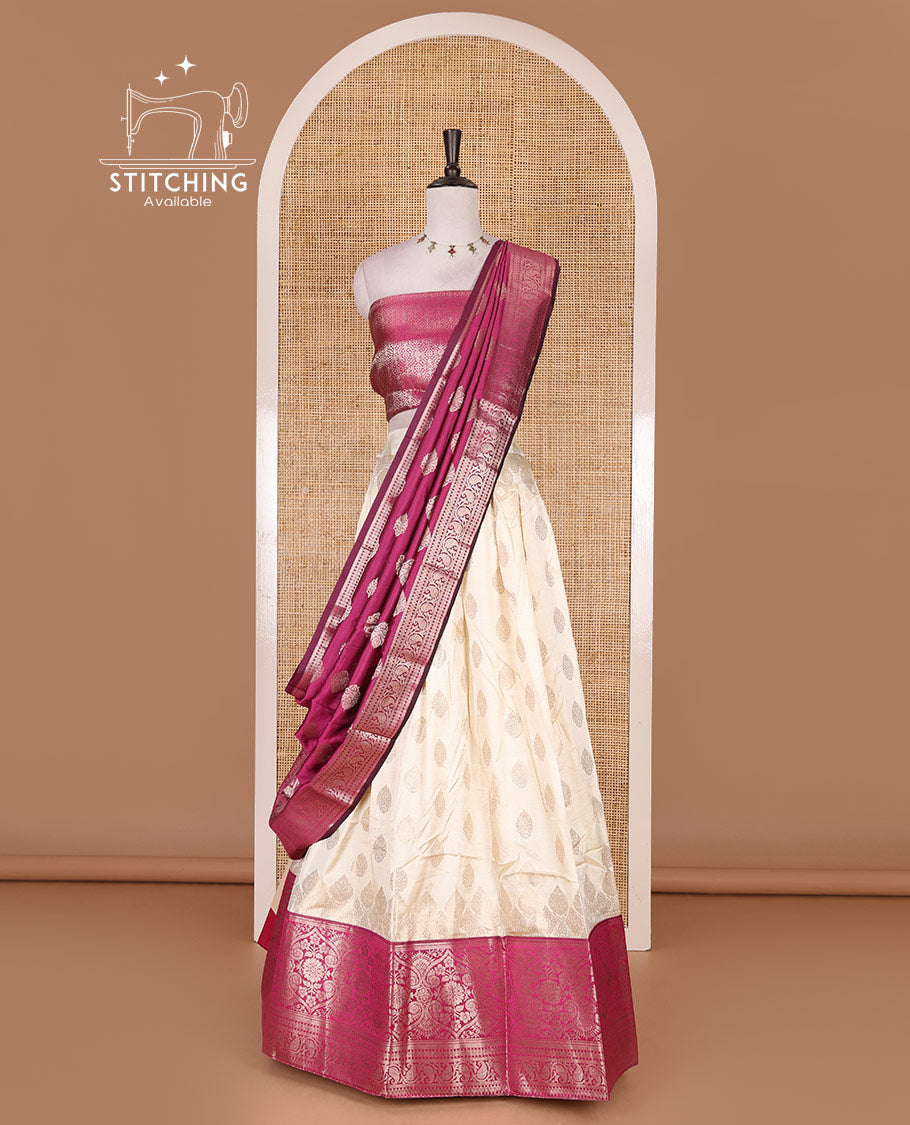 Cream with magenta semi-banarasi half-saree, zari buttas with contrast traditional zari border skirt, zari jacquard blouse, and zari design dhavani