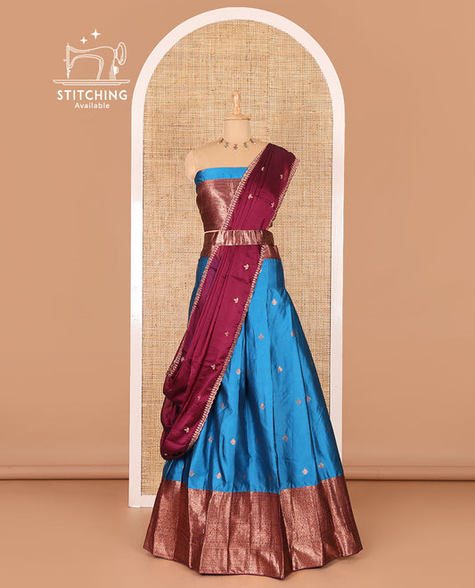 Blue taffeta silk half-saree, zari buttas and contrast traditional zari bordered skirt, a matching blouse, and contrast embroidered satin georgette  dhavani
