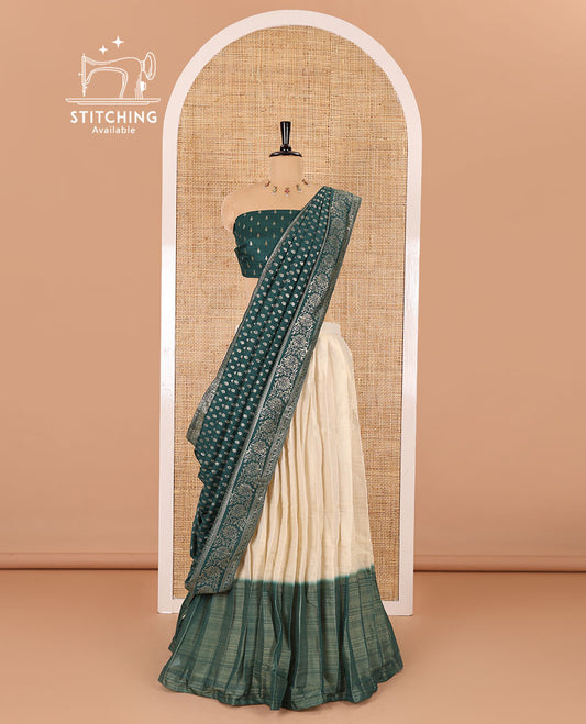 Cream-green Vichitra half-saree, plain and contrast bordered skirt, contrast leaf buttas blouse, dhavani of buttas and floral creeper designs