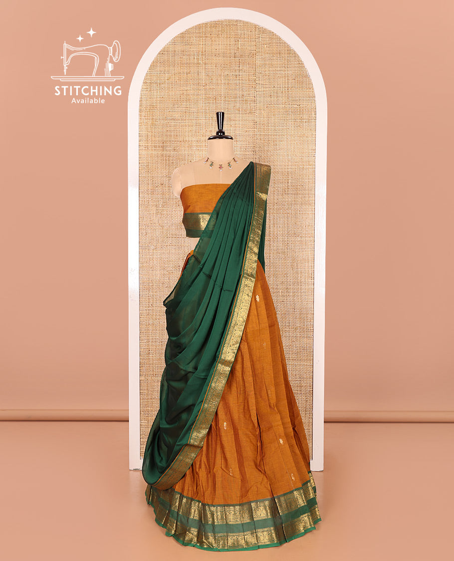 Mustard and Green Chettinad Cotton Half-Saree Featuring Buttas Woven Skirt, Highlighted with a Contrast Rettai Pettu Peacock Motifs Woven Zari Border, a Subtly Woven Matching Blouse, and a Vichitra Silk Contrast Traditional Zari-Bordered Dhavani