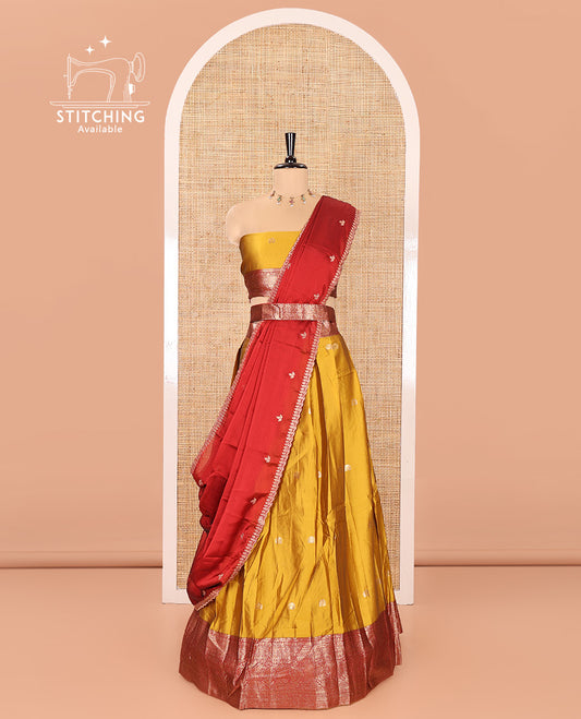 Mustard Semi-Banarasi Half-Saree, Adorned with Zari Buttas on Its Skirt, Complemented by a Contrast Traditional Zari Designs Woven Border, Paired with a Matching Blouse, and a Satin Georgette Embroidered Scallop Dhavani