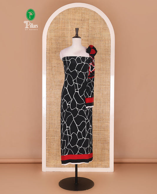 Black and white Italian crepe material churidar set, geometric printed top, plain bottom, and dupatta of floral and geometric print