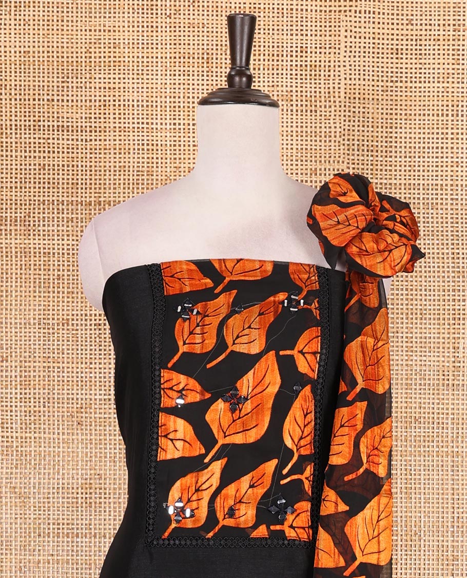 Black and orange material churidar set, neck leaf print with mirror work Vichitra silk top, plain santoon bottom, and leaf printed shimmer georgette dupatta