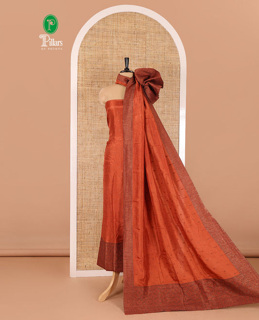 Rust material chudidar set, copper zari buttas and jaal design semi-modal silk top, plain santoon bottom, and zari design woven semi-modal silk dupatta
