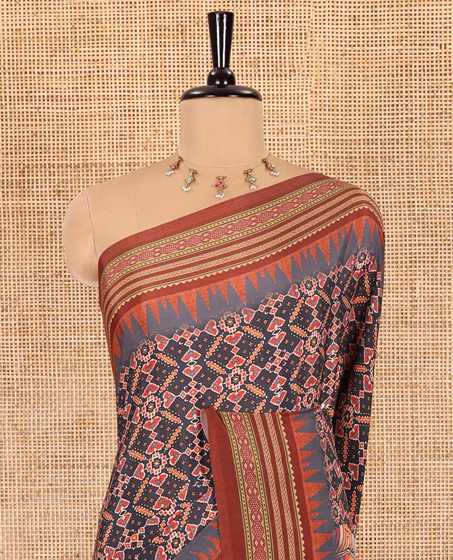 Grey patola style geometric printed Italian Crepe saree, contrast temple ikkat printed border, Kalamkari printed pallu, and a printed bordered blouse