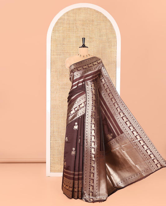 Coffee Brown Litchi Silk Saree, Majestically Detailed with Zari Stripes and Pichwai Cow Buttas All Over Its Body, Highlighted by a Pichwai Cow-Themed Zari Border, Grandly Zari Woven Pallu, and Paired with a Matching Blouse