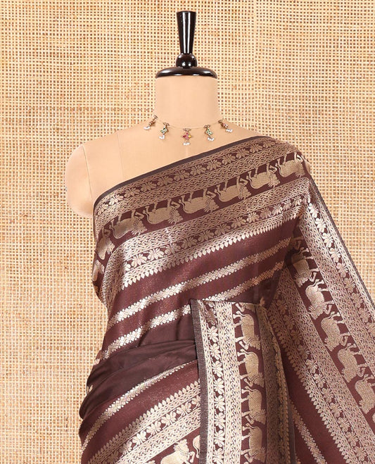 Coffee Brown Litchi Silk Saree, Majestically Detailed with Zari Stripes and Pichwai Cow Buttas All Over Its Body, Highlighted by a Pichwai Cow-Themed Zari Border, Grandly Zari Woven Pallu, and Paired with a Matching Blouse