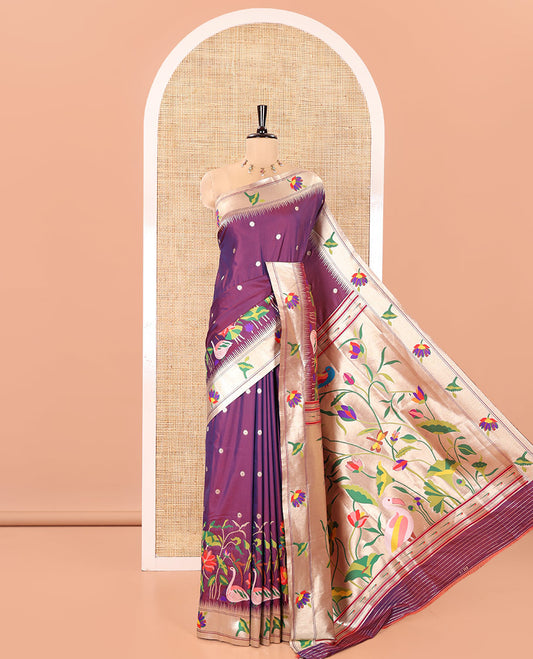 Purple Paithani Art Silk Saree, Embellished with Flower Buttas All Over Its Body, Highlighted by Zari Temple Border Pictures Colorful Flora-Fauna Designs, Pallu Depicts Colorful Floral and Bird Designs, and Paired with a Matching Blouse