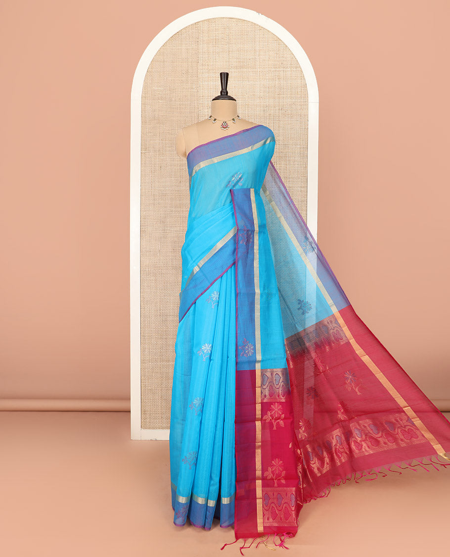 Blue Silk Cotton Saree Ornamented with Buttas All Over the Body, Complemented by a Contrast Floral Zari Motifs Border, Featuring a Contrast Pallu of Floral Zari Designs, and Paired with a Contrast Blouse