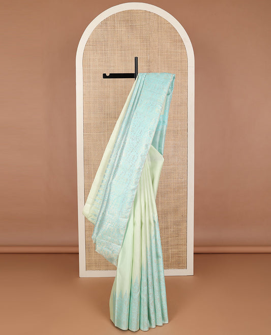 Bordeless blue with green floral jacquard silk saree & intricate zari design pallu