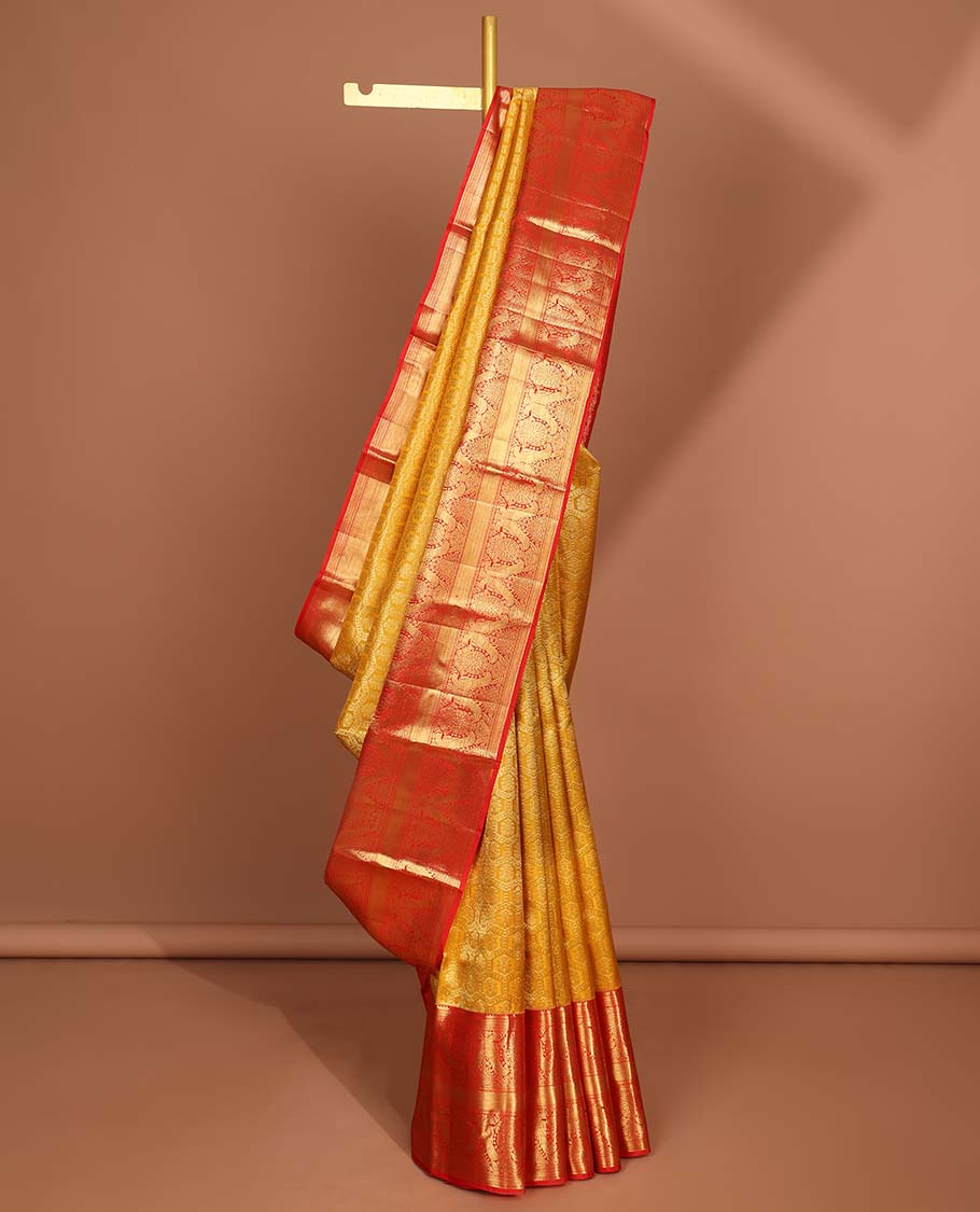 Yellow flower enclosed in hexegon design silk saree with contrast border of rekku,mayil,muthu, banaras design & intricate zari pallu