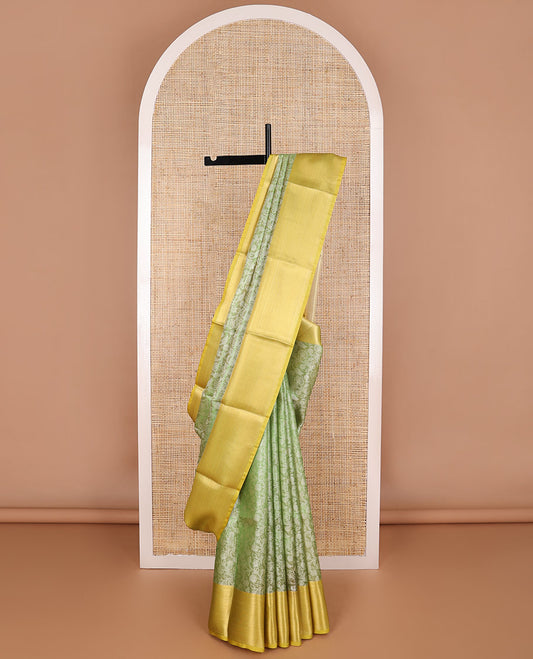 Green floral vine design tissue saree with contrast striped border & zari design pallu