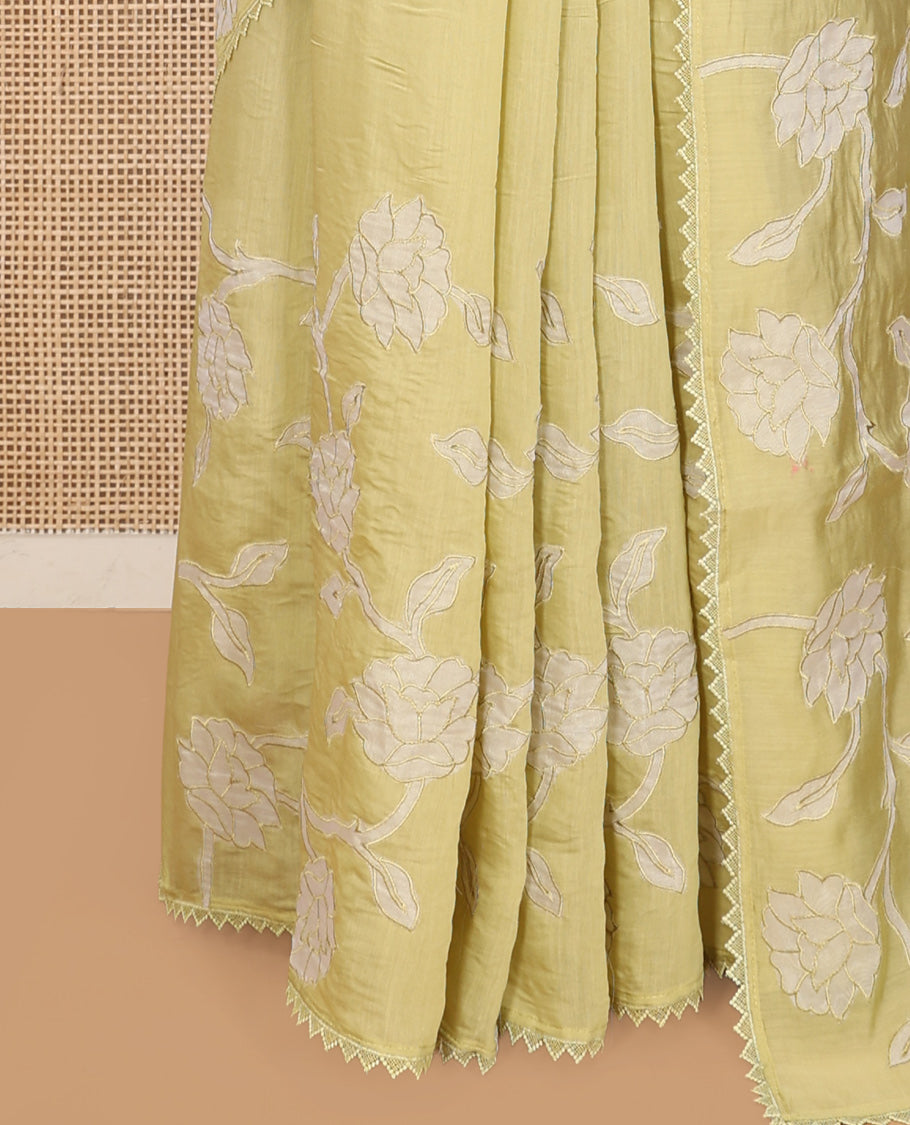 Pale Green Tussar Silk Saree, Prettified with Floral Vine Embroidery, Lace Border, and a Matching Blouse