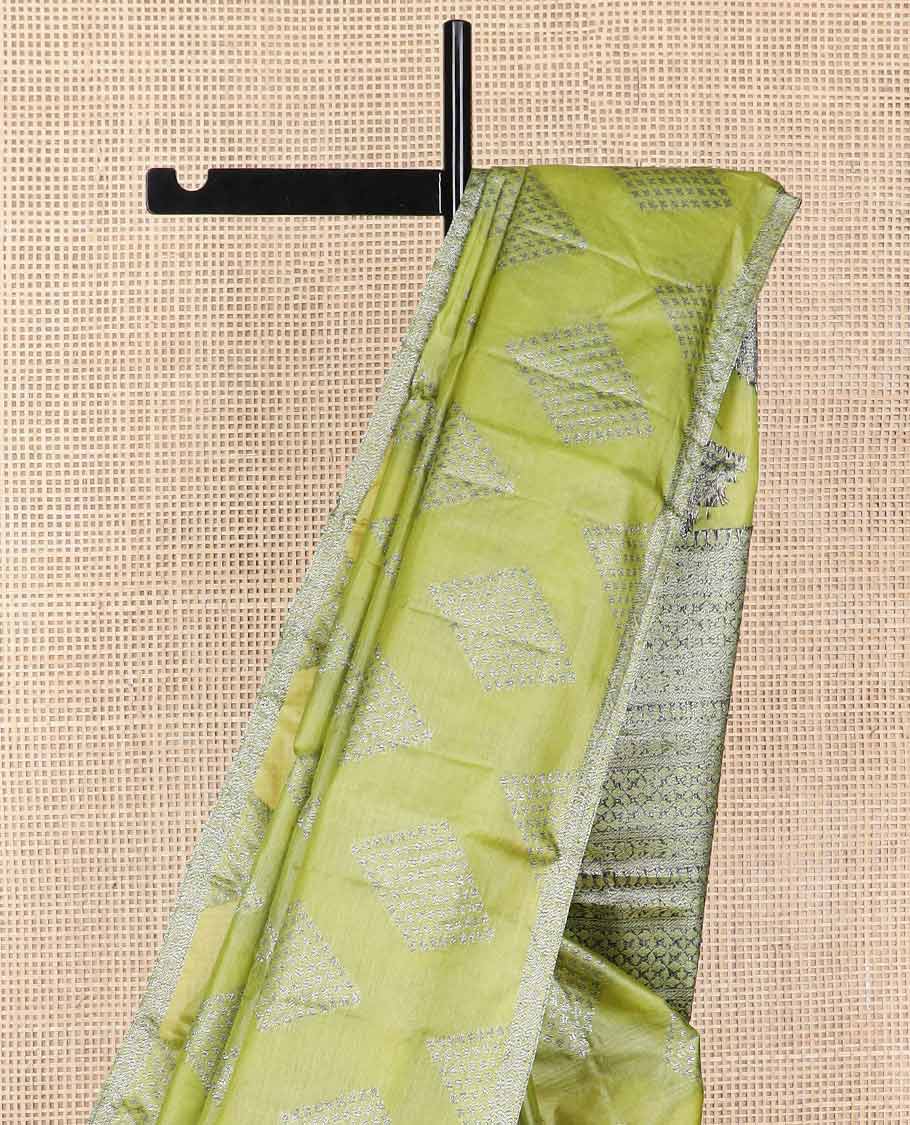 Green geometric motifs tussar silk saree with self zari design border & floral design pallu
