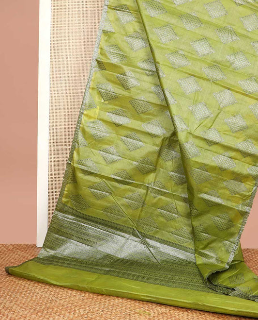 Green geometric motifs tussar silk saree with self zari design border & floral design pallu
