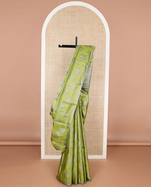 Green geometric motifs tussar silk saree with self zari design border & floral design pallu