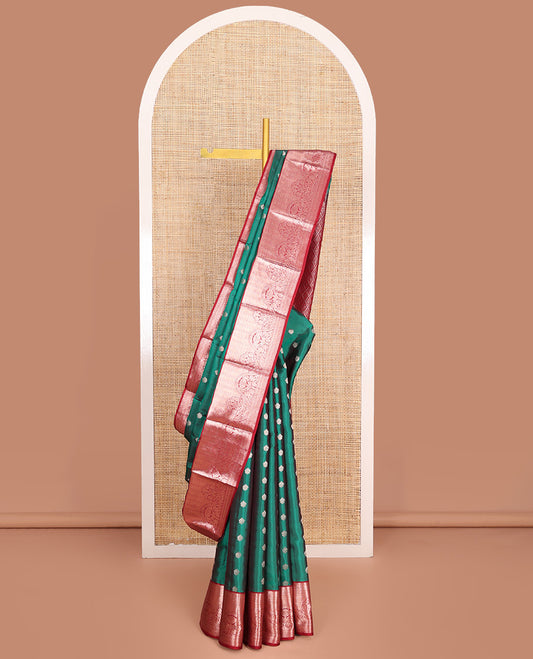 Green Vasundhara Lite-Silk Mix Saree, Ornamented with Zari Buttas All Over Its Body, Complemented by a Contrast Border of Rekku, Kathir, Mayil Kann, and Floral Designs, Grand Pallu of Jaal Designs, and Paired with a Contrast Blouse