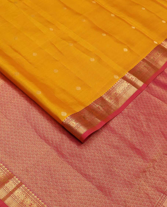 Yellow zari buttas Vasundhara silk mix saree, contrast border of manga, muthu, diamond, jada nagam, and mayil kann, and jaal pallu