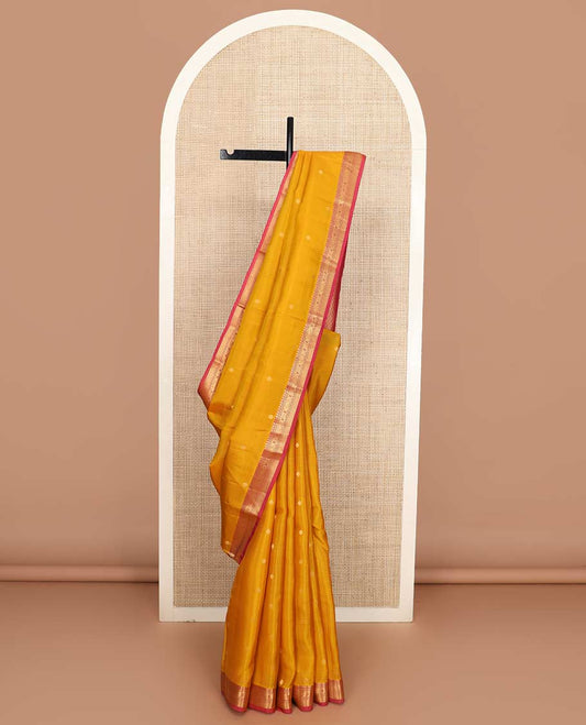Yellow zari buttas Vasundhara silk mix saree, contrast border of manga, muthu, diamond, jada nagam, and mayil kann, and jaal pallu