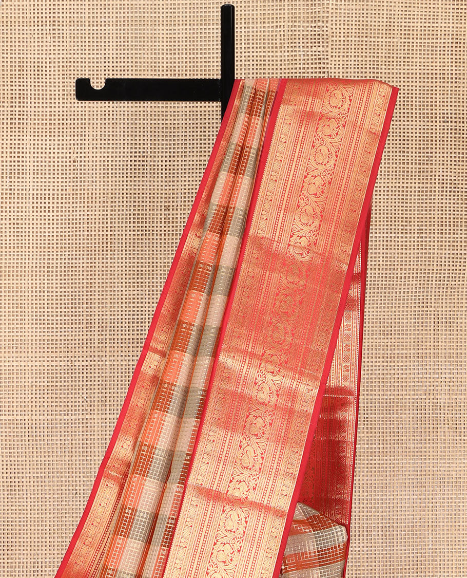 Grey-Orange Striped Vasundhara Lite Silk Mix Saree, Gleamed Up with a Zari Checks on Its Body, Complemented by a Contrast Border of Rekku, Diamond, Mayil, and Kodi Mayil Designs, Gleaming Zari Pallu, and Paired with a Contrast Blouse