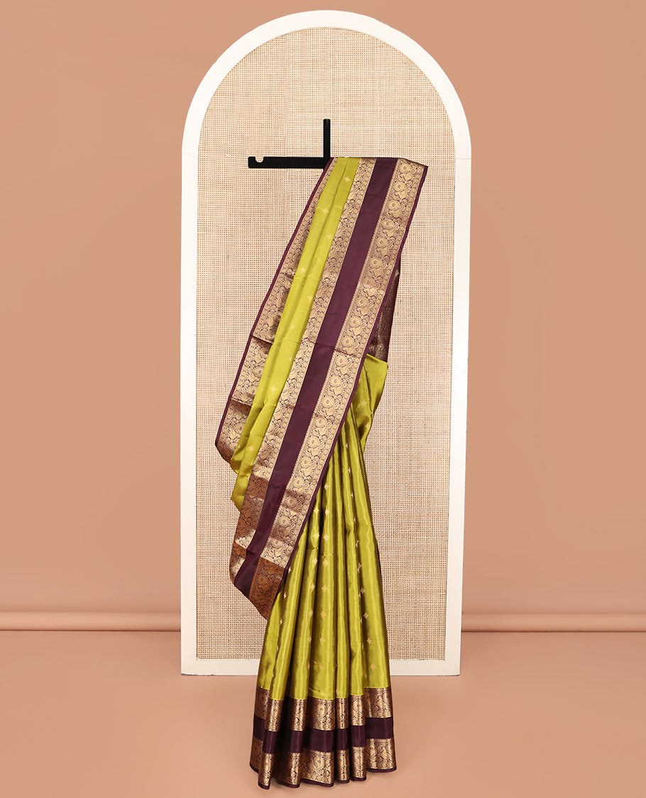 Green Vasundhara Lite Silk Mix Saree, Finely Crafted with Zari Buttas on Its Body, Complemented by Contrast Rettai Pettu Border of Mayil and Laddu Kamalam Designs, Pallu Mirrors the Same Designs, and Paired with a Contrast Blouse