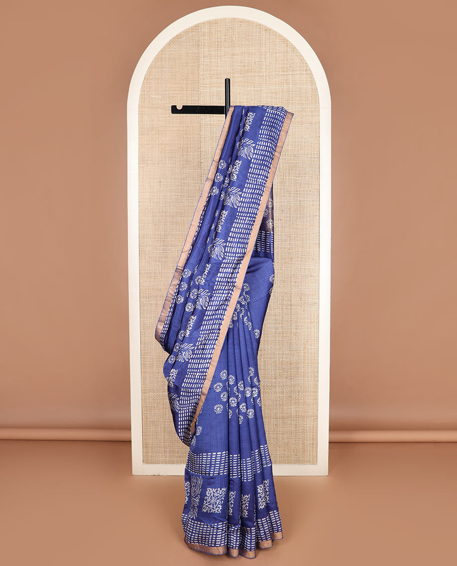 Blue floral and geometric printed banana pith saree, zari border, and printed pallu