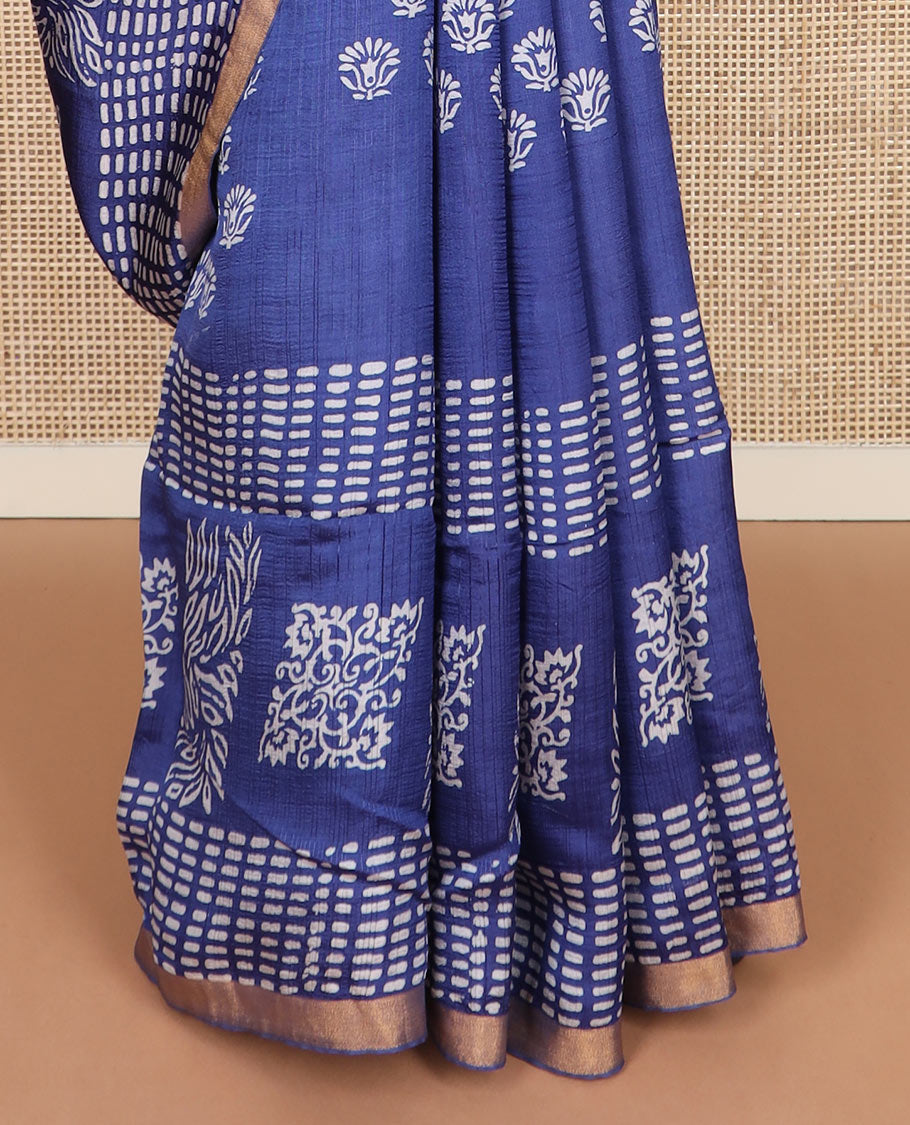 Blue floral and geometric printed banana pith saree, zari border, and printed pallu