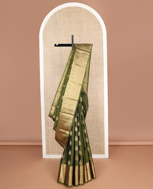 Green leaf buttas silk saree with contrast border of poo chakram, kuyil kann design & zari design pallu