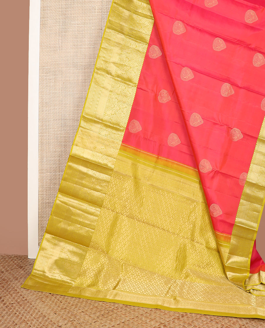 Red zari buttas silk saree, contrast border of thilakam mokku, muthu, yaali, and mayil kann, and geometric pallu
