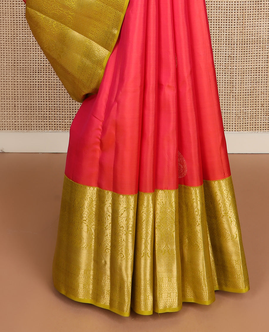 Red zari buttas silk saree, contrast border of thilakam mokku, muthu, yaali, and mayil kann, and geometric pallu