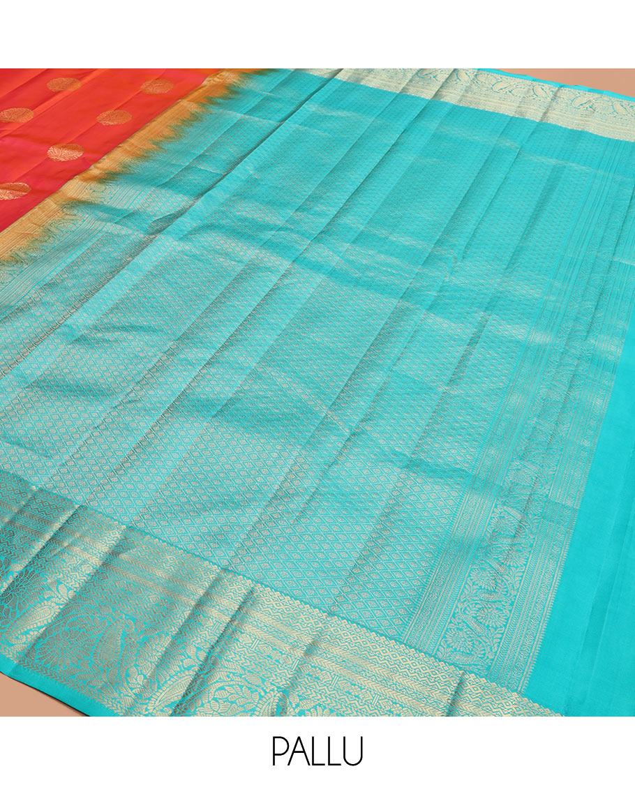 Orange Vasundhara Silk Saree Artfully Detailed with Zari Buttas, Complemented by a Contrast Border of Salngai, Neli, Kathir, and Floral-Paisley Designs, Zari-Rich Jaal Pallu, and Paired with a Contrast Zari-Bordered Blouse