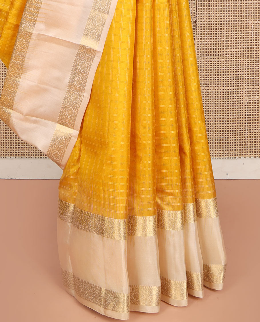 Yellow Vasundhara Silk Saree, Subtly Sparkled with Checked All Over Its Body, Complemented by Contrast Rettai Pettu Border of Thilakam Mokku, and Cross Kamalam Designs, Pallu of Jaal Designs, and Paired with a Contrast Blouse
