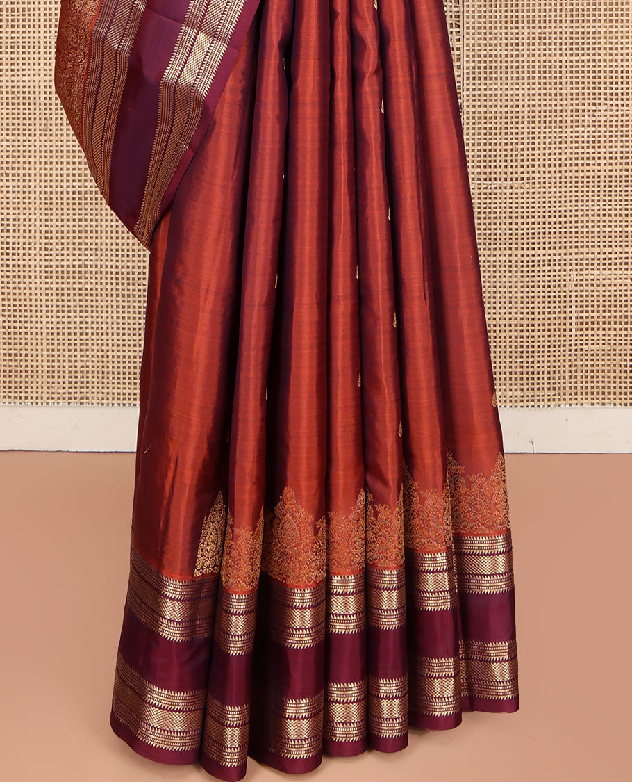 Rust Orange Vasundhara Silk Saree, Enriched with Zari Buttas All Over Its Body, Complemented by a Contrast Rettai Pettu Border of Ara Bogudi, Banaras, Muthu, and Ara Maadam Designs, Grand Jaal Pallu, and Paired with a Contrast Blouse