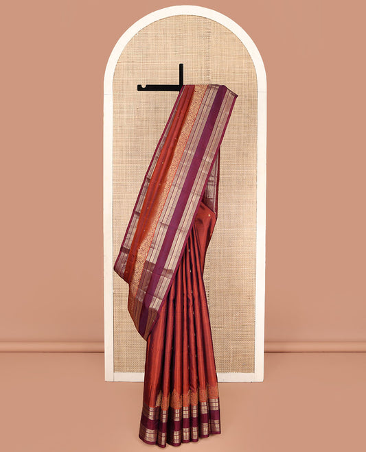 Rust Orange Vasundhara Silk Saree, Enriched with Zari Buttas All Over Its Body, Complemented by a Contrast Rettai Pettu Border of Ara Bogudi, Banaras, Muthu, and Ara Maadam Designs, Grand Jaal Pallu, and Paired with a Contrast Blouse